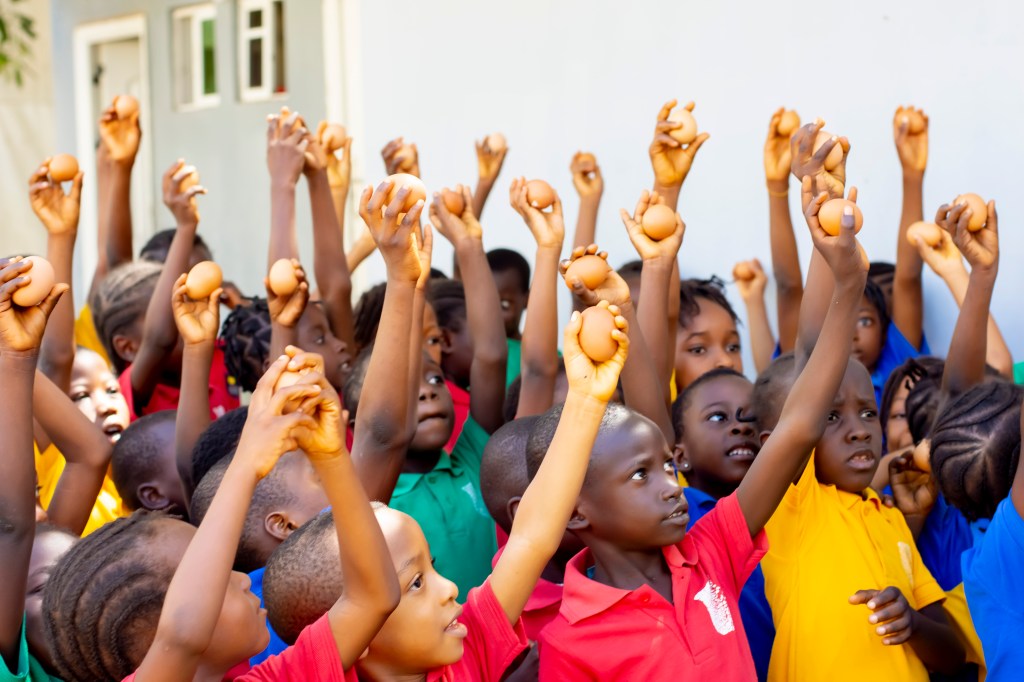 A Dozen Reasons to Smile: Eggs of Hope Nourishes 100 Children at Gratis School